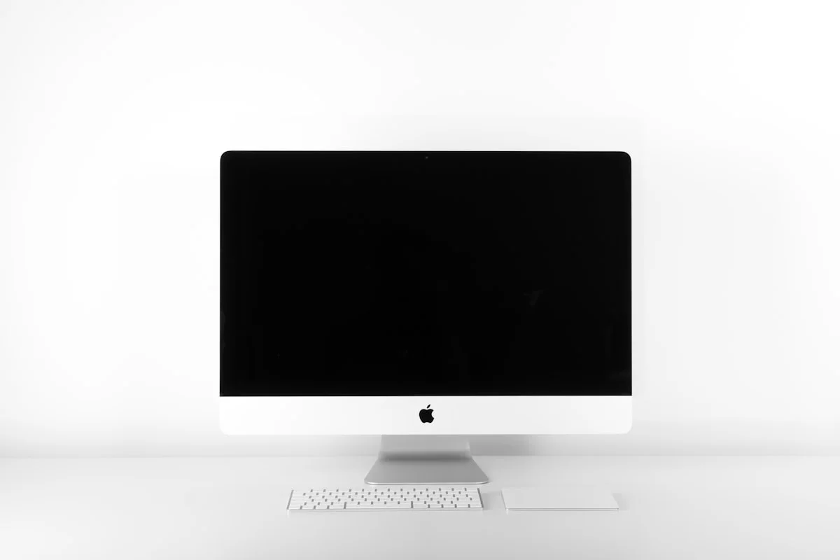 High-end gaming monitor displaying vivid colorful visuals on a desk with RGB lighting